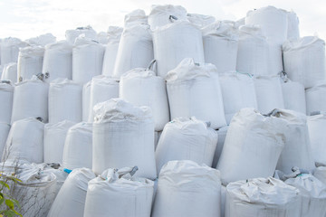 Mountain of white full bags at construction, at factory