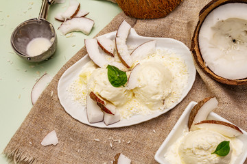 Lactose free coconut ice cream. Special spoon, halves of fruit, flakes