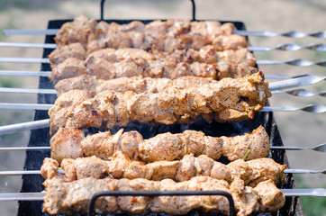 kebab photo close-up. The meat with a golden crust is grilled. Vacation and weekend concept.