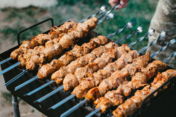 kebab photo close-up. The meat with a golden crust is grilled. Vacation and weekend concept