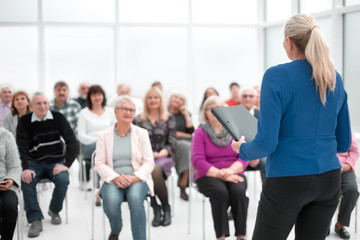 Businesswoman addressing colleagues at office meeting