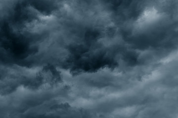 Obraz premium Stormy rain big fluffy clouds. Dark sky. Natural scenic abstract background. Weather changes backdrop. Sky filled with voluminous clouds.