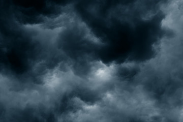 Obraz premium Stormy rain big fluffy clouds. Dark sky. Natural scenic abstract background. Weather changes backdrop. Sky filled with voluminous clouds.