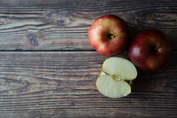Naklejka na ściany i meble Apples on a wooden table picture from above