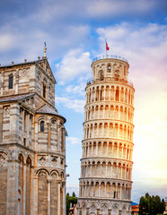 Fototapeta na wymiar The baptistery at the Piazza Dei Miracoli with the famous Leaning Tower and the dome, Pisa, Tuscany, Italy, Europe at the sunset. The Leaning Tower of Pisa, reestanding bell tower