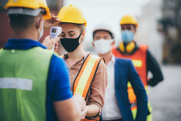 Staff are checking fever for workers, engineers and foreman. In the storage area that prepares international shipping