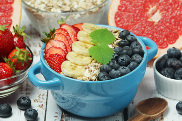 Healthy diet breakfast including cereal with berry and fruits