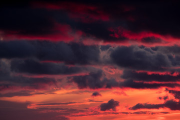 large dark clouds at sunset in spring