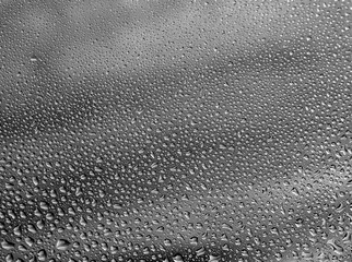 water drops on the gray glass close-up.