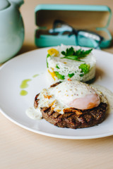 poached egg on steak with rice garnish