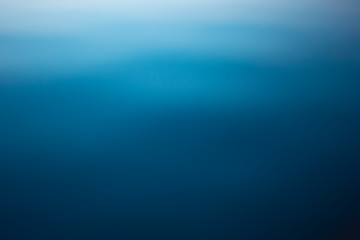 Blue water surface. Deep blue water background. Beautiful background, space for text.