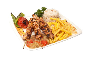 Turkish chicken shish kebab, with rice fries, pepper, eggplant