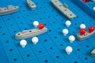 Battleship, board game. Sea battle. Toy ships on a plastic board. Perfect hit. Victory or defeat....