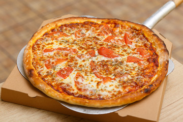 Preparing traditional italian pizza.
