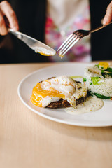 poached egg on steak with rice side dish