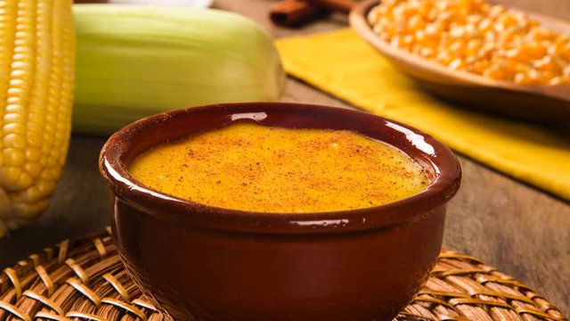 Slide shot Corn Curau with smoke - typical food of green corn - tasty and cheap - typical and popular street food