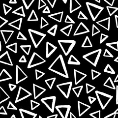 Seamless vector pattern with isolated outline triangles on black background in doodle style