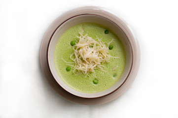 pea soup with cheese in a bowl