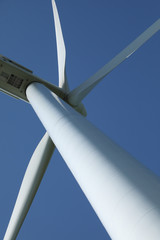 Windmill for electric power production, France. Blue sky