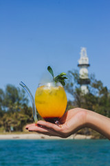 hand holding a glass of water