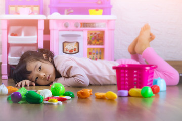 Sad little girl sitting on floor with toy,children crying, little girl cry, feeling sad, young girl unhappy.