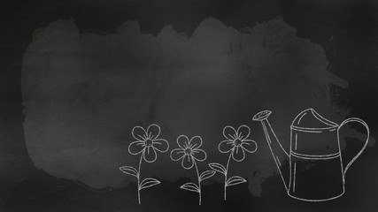 a blackboard with garden tools and various flowers with copy space section