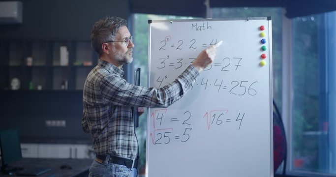 Teacher explaining math to camera