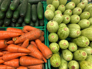 Carrots, vegetable marrow and cucumbers in a supermarket