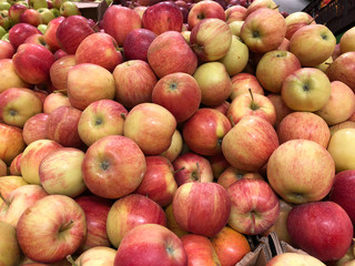 Close-up red-yellow apples in a supermarket, food and retail concept