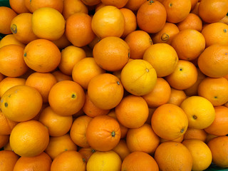 Close-up oranges fruits in a supermarket, food and retail concept
