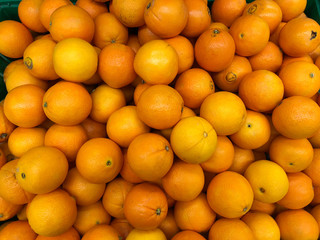 Close-up oranges fruits in a supermarket, food and retail concept