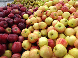 Close-up red-yellow apples in a supermarket, food and retail concept
