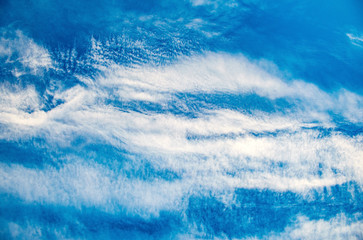Naklejka na ściany i meble Summer bright blue sky with clouds outdoor background