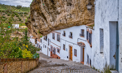 Fototapeta na wymiar The homes built under a protruding rock face in Setenil de las bodegas Spain