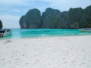 Maya Bay - Beautiful beach in Phi Phi Island, Famous landmark travel Phuket Thailand beach. Tourism destination Asia trips. Nobody. It's a nasty day. Moored boats