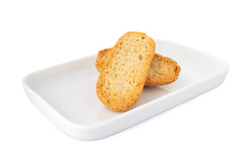 Double crispy biscottes, french toast bread on white plate, on white background
