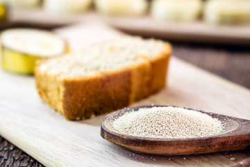 spoon with dry biological yeast, used in organic, vegetarian and vegan products. Healthy vegan life concept.