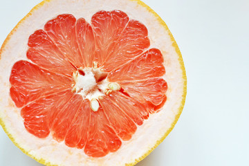 Fresh cut grapefruit fruit on white background