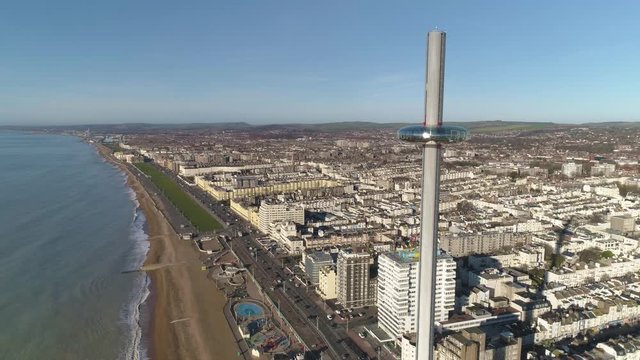British Airways i360 viewing pod at the top of the tower, showing view over town and long shadow of tall tower