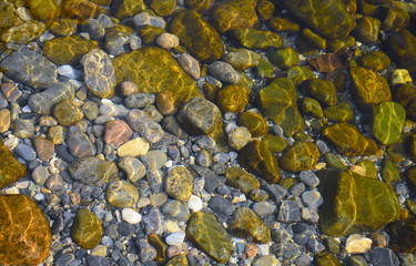 Obraz na płótnie Canvas Abstract background with pebbles - round sea stones