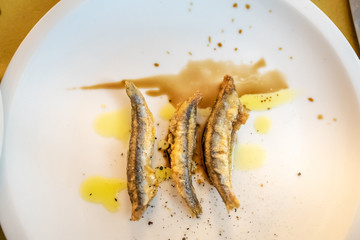 Fried anchovys served with Balsamic vinegar and Olive oil in Genova, Italy