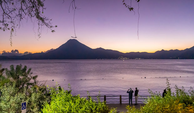 Lake atitlán at sunset with tourists