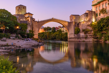 Fototapeta premium Mostar Bridge at sunset time, an Ottoman bridge in Mostar, Bosnia and Herzegovina