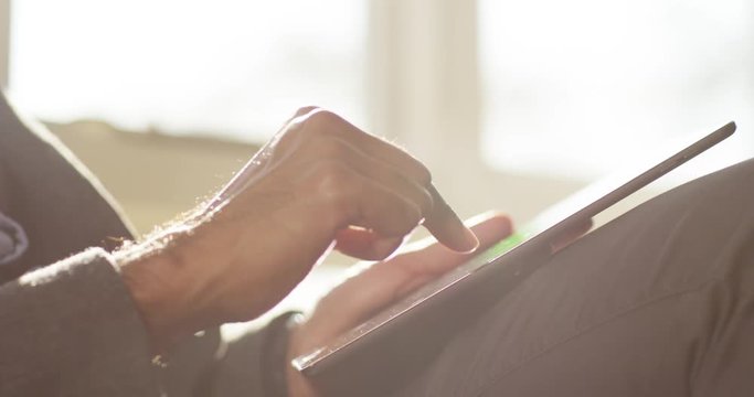 4k Attractive Indian business person using a digital tablet