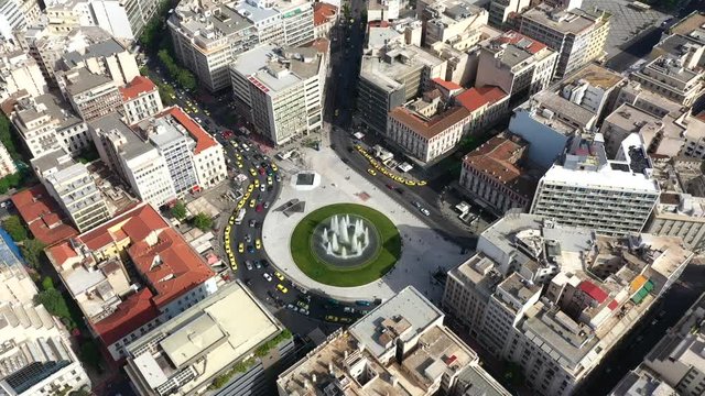 Aerial video 4k of recently renovated fountain of famous round square of Omonia in the heart of Athens centre, Attica, Greece