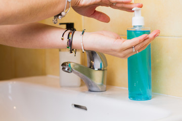 Woman is washing hands with soap and alcohol gel against  spreading coronavirus.
