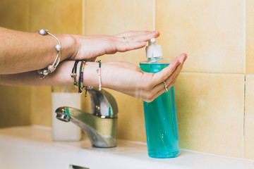 Woman is washing hands with soap and alcohol gel against  spreading coronavirus.