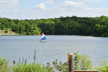 Small sailboat on midwestern lake
