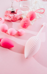 Female pink background with different sex toys. Online store, shopping, delivery, Stay at home concept