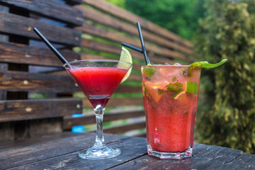 Red strawberry with lime and mint. A fresh summer non alcoholic fruit and berry cocktails.